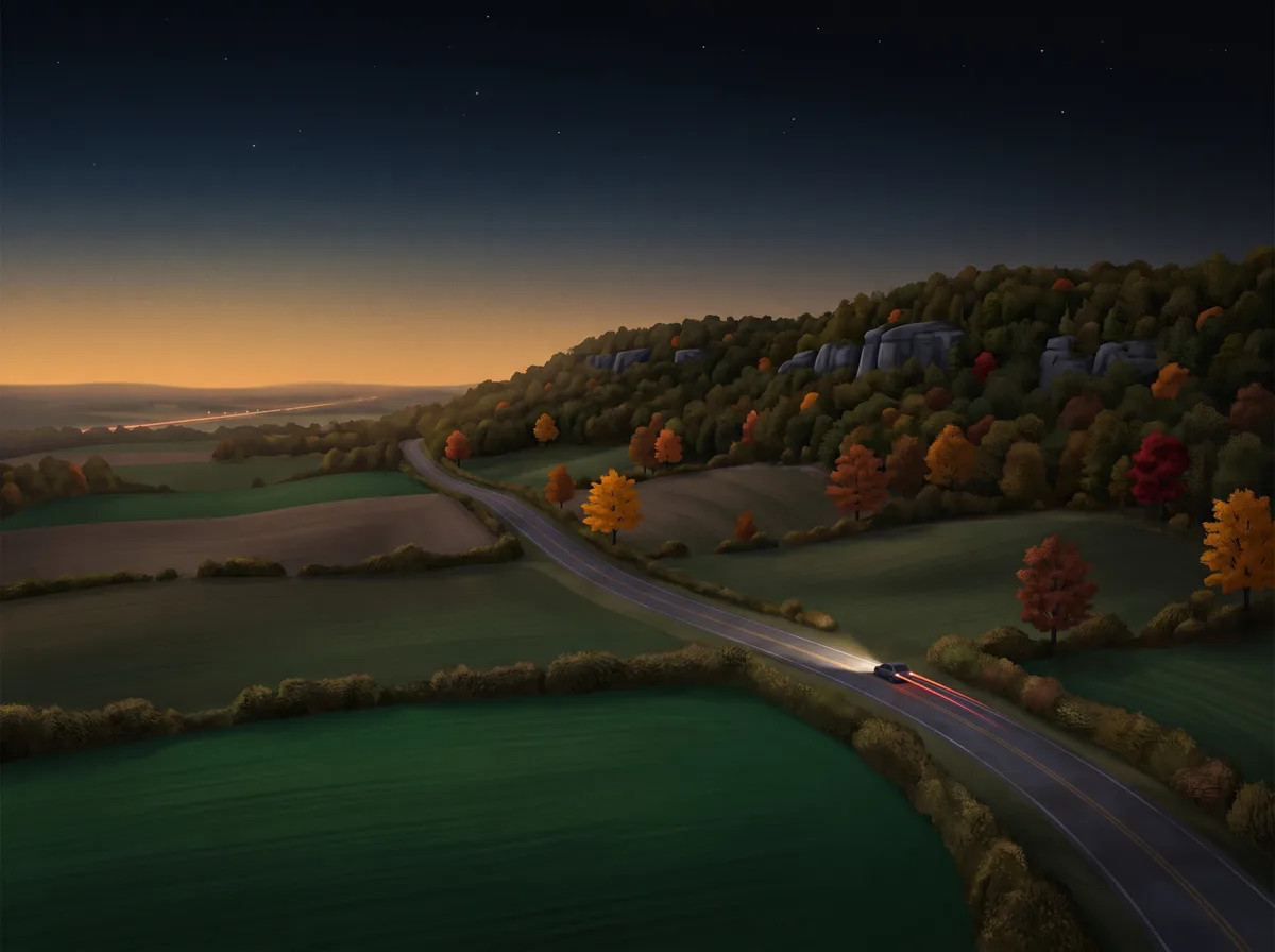 Escarpment countryside and a country road at dusk
